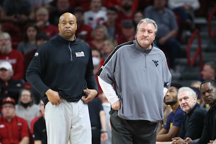 Jan 29, 2022; Fayetteville, Arkansas, USA; West Virginia Mountaineers assistant coach Erik Martin and head coach Bob Huggins during the game against the Arkansas Razorbacks at Bud Walton Arena. Arkansas won 77-68. Mandatory Credit: Nelson Chenault-USA TODAY Sports
